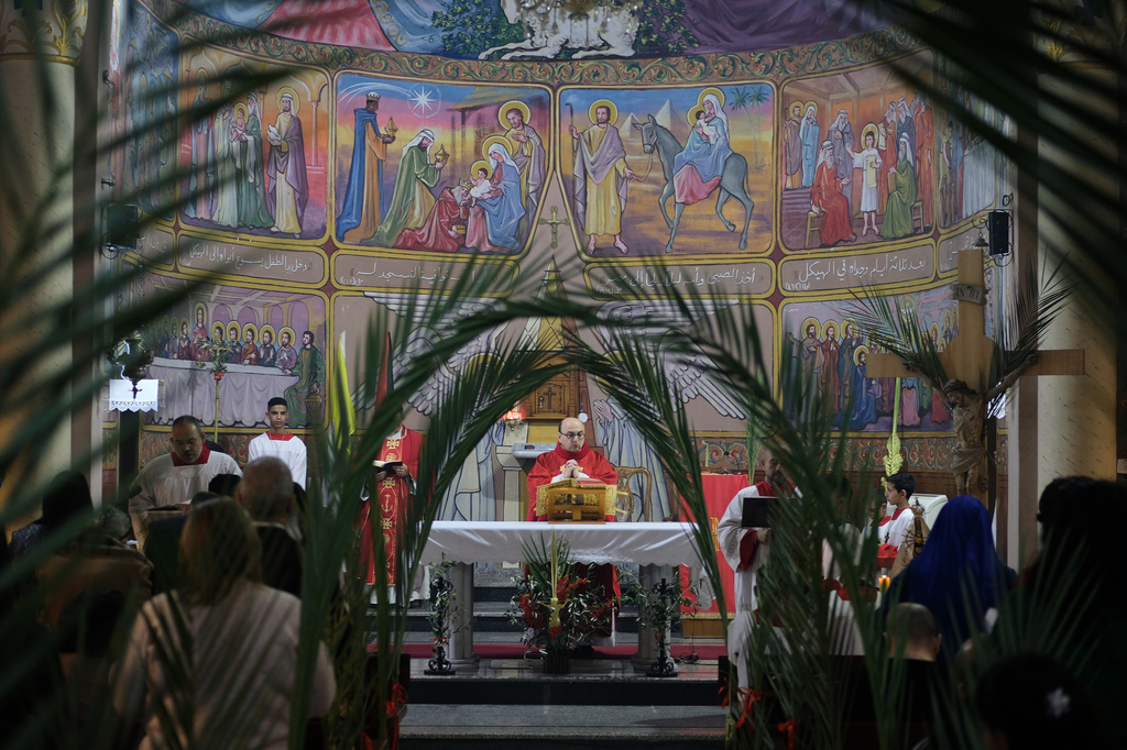 Christian clergy attend a Palm Sunday Mass in Gaza City Sunday, March 29, 2026. (AP Photo/Jehad Alshrafi)