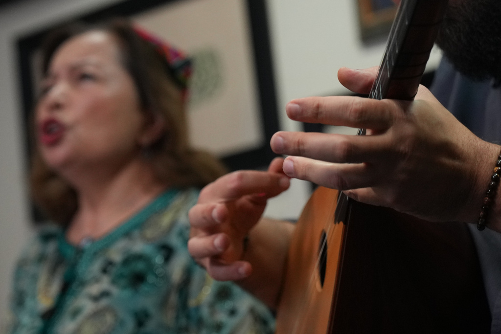 Members of the London Uyghur Ensemble perform during an interview with The Associated Press in London, Wednesday, Oct. 8, 2025. (AP Photo/Joanna Chan)
