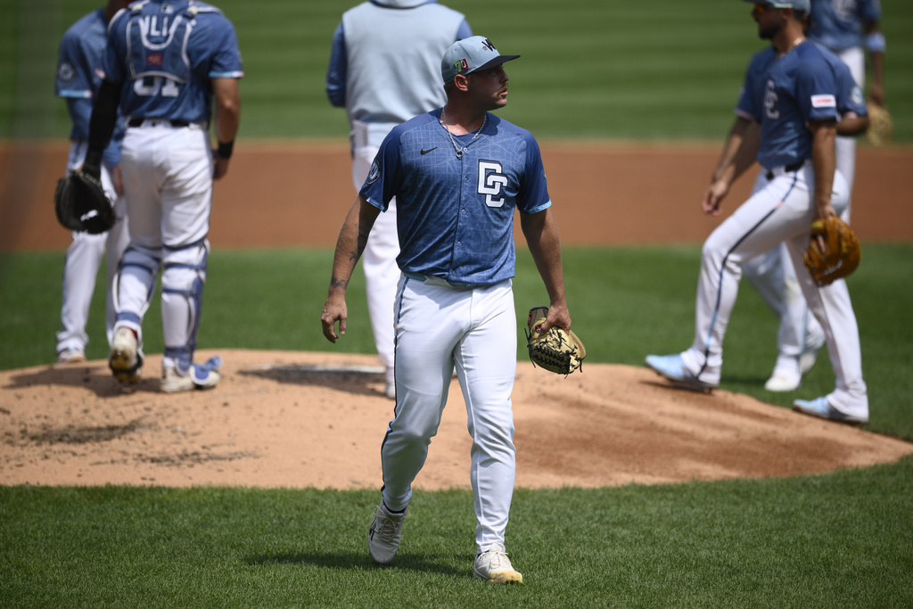 Washington Nationals starting pitcher Mitchell Parker (70) walks back to the dugout after he was pulled during the second inning of a baseball game against the Philadelphia Phillies, Sunday, Aug. 17, 2025, in Washington. (AP Photo/Nick Wass)