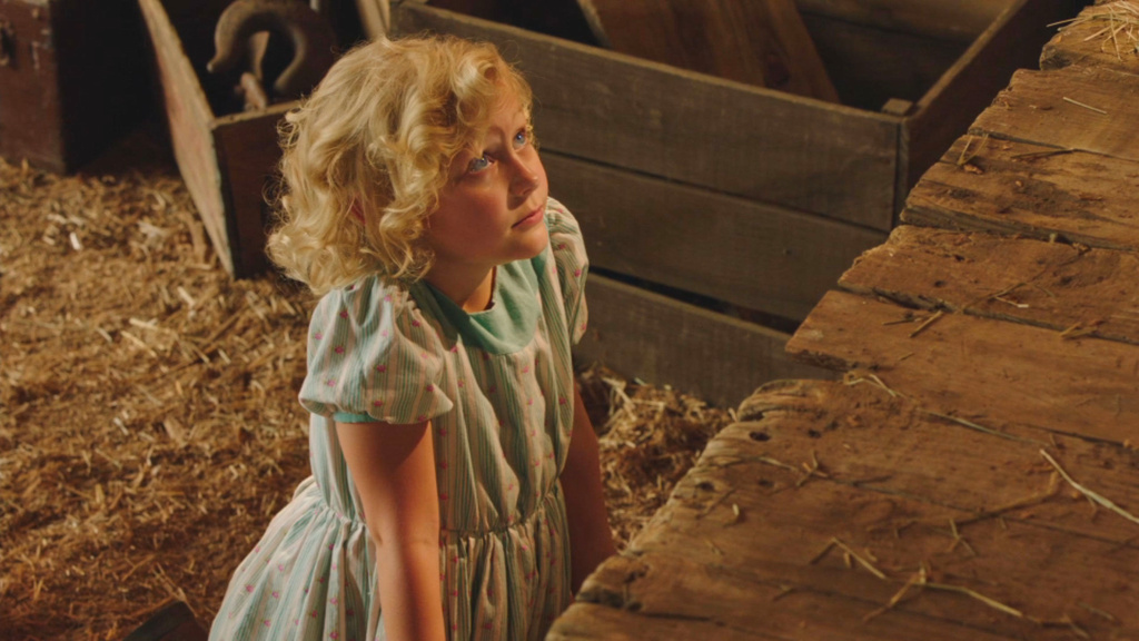 This image released by The CW shows Alyvia Alyn Lind in a scene from "Dolly Parton's Coat of Many Colors." (The CW Network via AP)