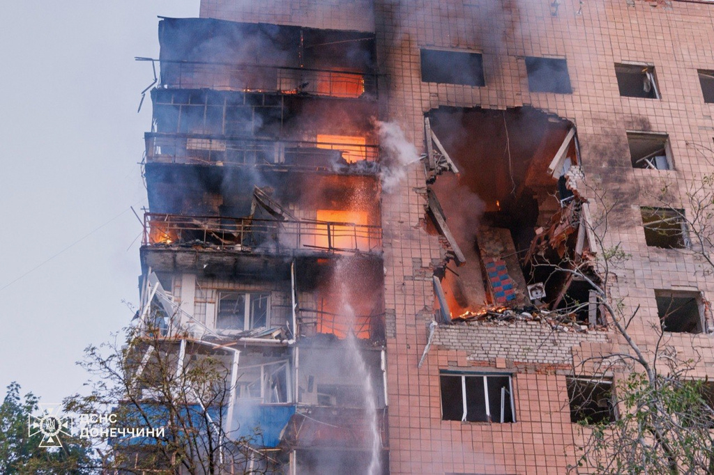 In this photo provided by the Ukrainian Emergency Service, a residential building is seen in fire following a Russian air attack in Kramatorsk, Donetsk region, Ukraine, Monday, July 20, 2026. (Ukrainian Emergency Service via AP)