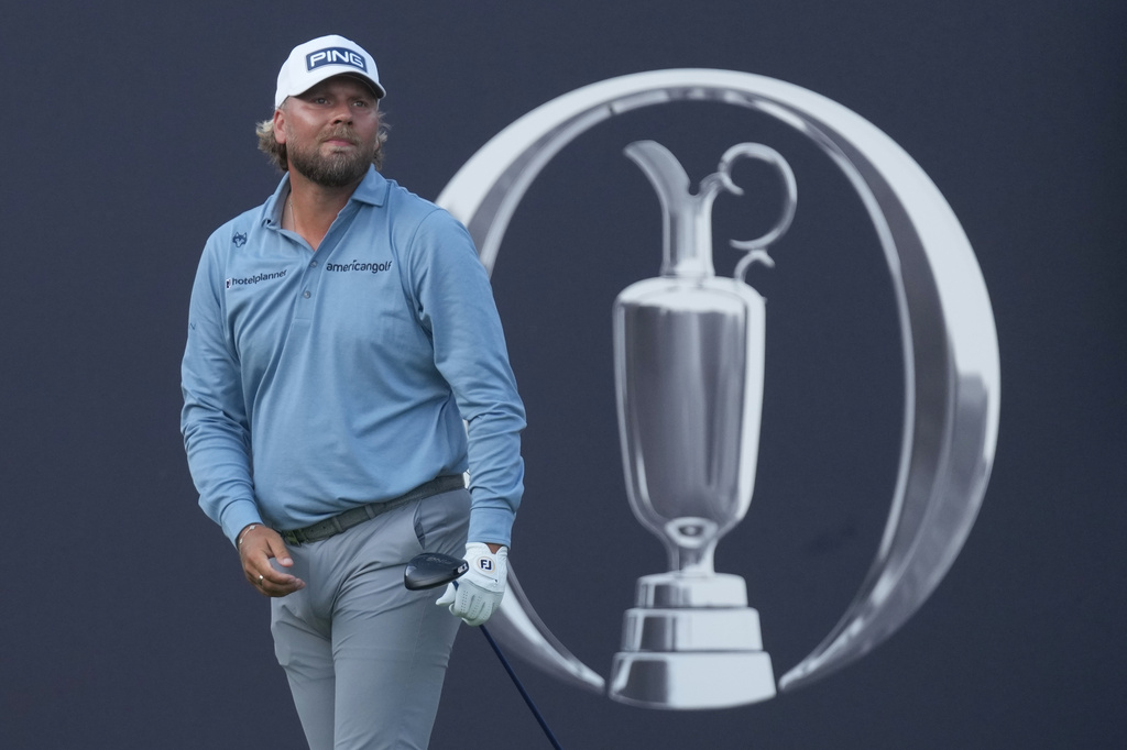 Daniel Brown of England watches where his shot has landed after playing off the 1st tee during the first day of the British Open Golf championships at Royal Birkdale golf club, in Southport, England, Thursday, July 16, 2026. (AP Photo/Jon Super)