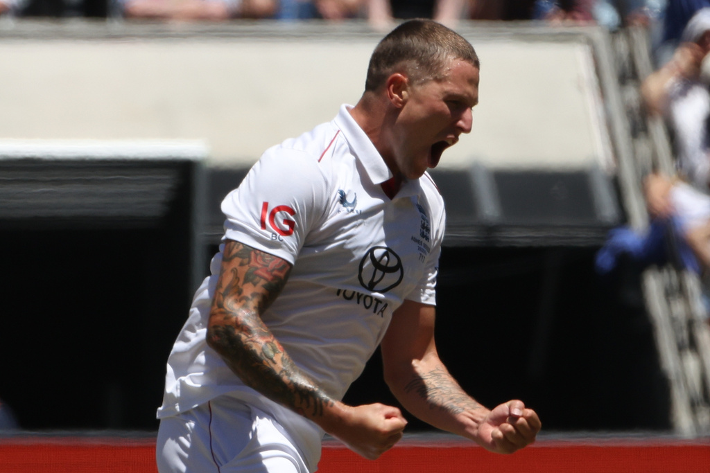 England's Brydon Carse celebrates the wicket of Australia's Mitchell Starc on Day 2 of their Ashes cricket test match in Melbourne, Saturday, Dec. 27, 2025. (AP Photo/Hamish Blair)