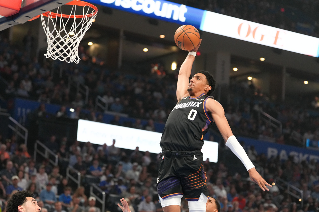 Phoenix Suns forward Ryan Dunn dunks during the first half of an NBA basketball game against the Oklahoma City Thunder, Sunday, April 12, 2026, in Oklahoma City. (AP Photo/Kyle Phillips)
