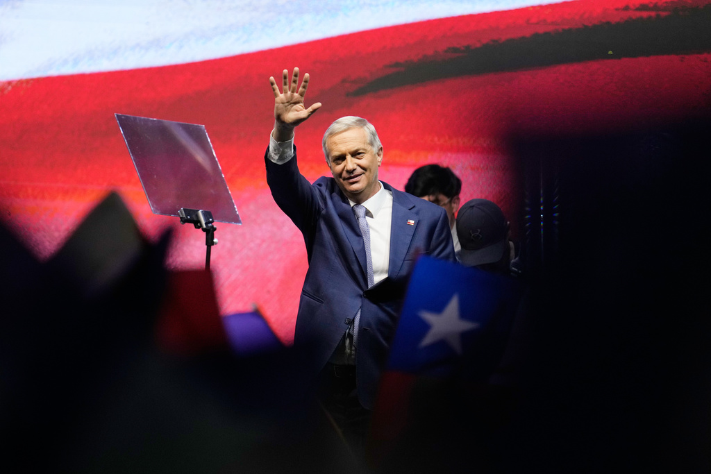 Presidential candidate Jose Antonio Kast, of the opposition Republican Party, waves after winning the presidential runoff election in Santiago, Chile, Sunday, Dec. 14, 2025. (AP Photo/Matias Delacroix)