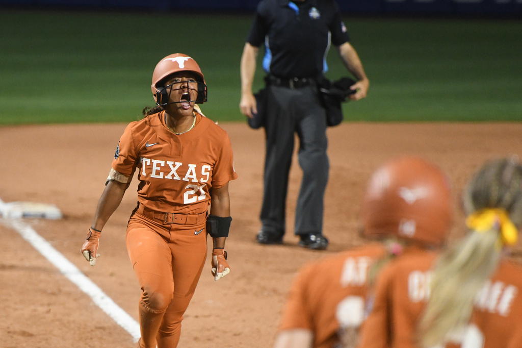 Texas' Kayden Henry celebrates after hitting a home run during the second game of the NCAA Women's College World Series softball finals against Texas Tech in Oklahoma City, Thursday, June 4, 2026. (AP Photo/Kyle Phillips)