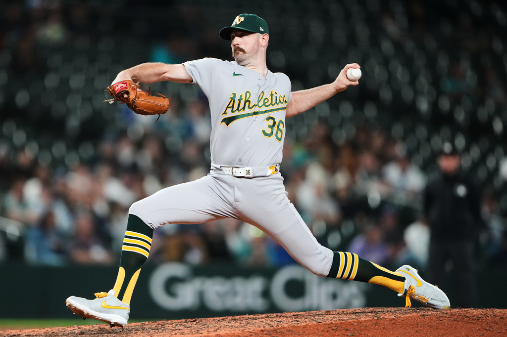 Athletics relief pitcher Hogan Harris throws against the Seattle Mariners during the ninth inning of a baseball game, Thursday, Sept. 3, 2026, in Seattle. (AP Photo/Lindsey Wasson)