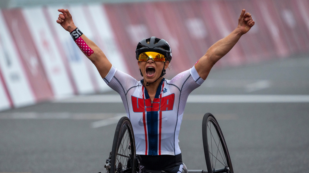 FILE - Oksana Masters, of the United States, celebrates after winning at Women's H5 Road Race at the Fuji International Speedway at the Tokyo 2020 Paralympic Games, Sept. 1, 2021, in Tokyo, Japan. (AP Photo/Emilio Morenatti, File)