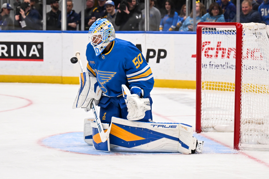 St. Louis Blues' Jordan Binnington (50) makes a save during the third period of an NHL hockey game against the Toronto Maple Leafs' Saturday, March 28, 2026, in St. Louis. (AP Photo/Connor Hamilton)