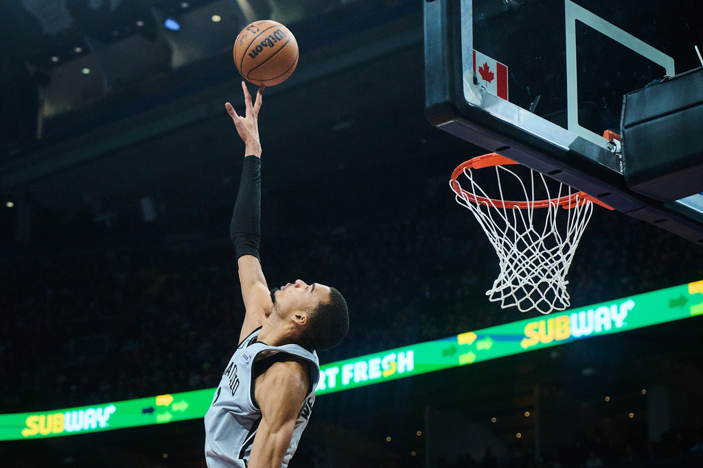 San Antonio Spurs' Victor Wembanyama (1) jumps to block a shot during the first half of an NBA basketball game, against the Toronto Raptors, in Toronto, Wednesday, Feb. 25, 2026. (Sammy Kogan/The Canadian Press via AP)