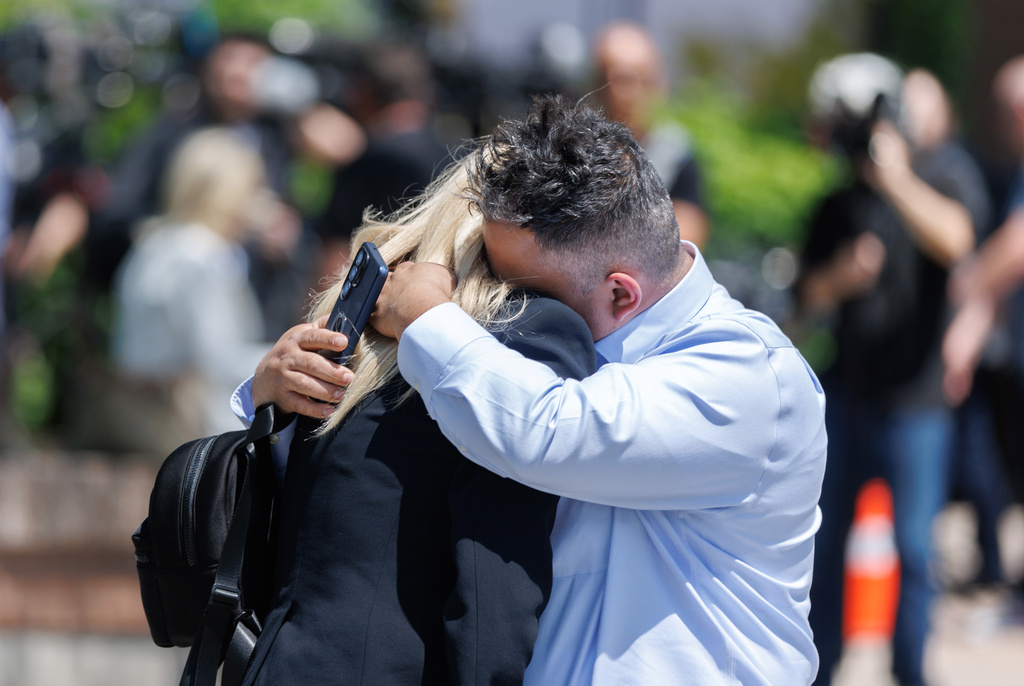 FILE - Leonardo Bedoya embraces his wife Maria Lopez outside the Ontario Court of Justice, May 29, 2026, in Newmarket, Ontario. (Christopher Drost/The Canadian Press via AP, File)