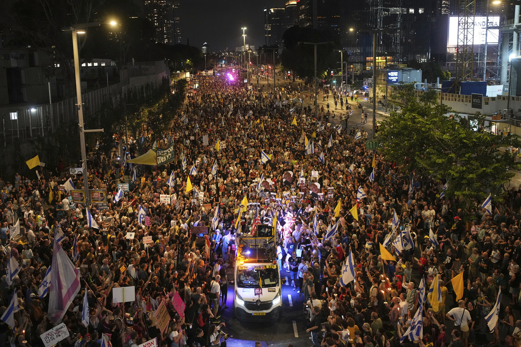 Relatives and supporters of Israeli hostages held in the Gaza Strip attend a rally demanding their release from Hamas captivity and calling for an end to the war, in Tel Aviv, Israel, Saturday, Aug. 9, 2025. (AP Photo/Ohad Zwigenberg)