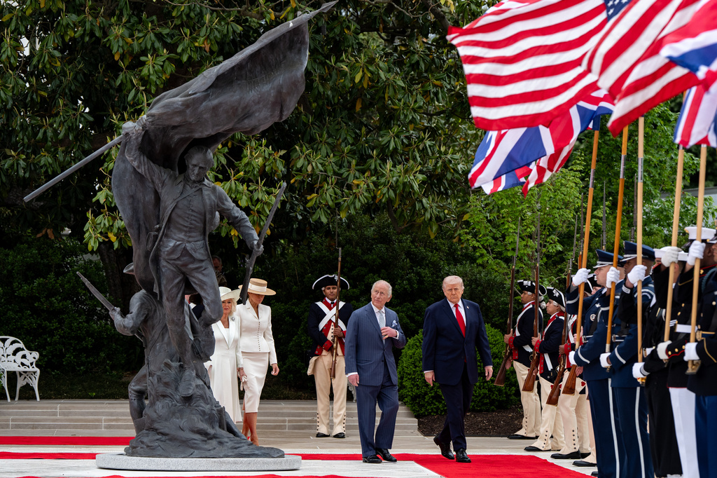 FILE - President Donald Trump walks on the red carpet in the Rose Garden with Britain's King Charles III, Queen Camilla and first lady Melania Trump at the White House, April 28, 2026, in Washington, during a State Visit. (AP Photo/Alex Brandon, File)