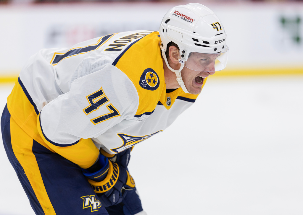 Nashville Predators' Michael McCarron (47) skates back to the bench in pain after a slash in the second period of an NHL hockey game against the Minnesota Wild, Tuesday, Dec. 23, 2025, in St. Paul, Minn. (Carlos Gonzalez/Star Tribune via AP)