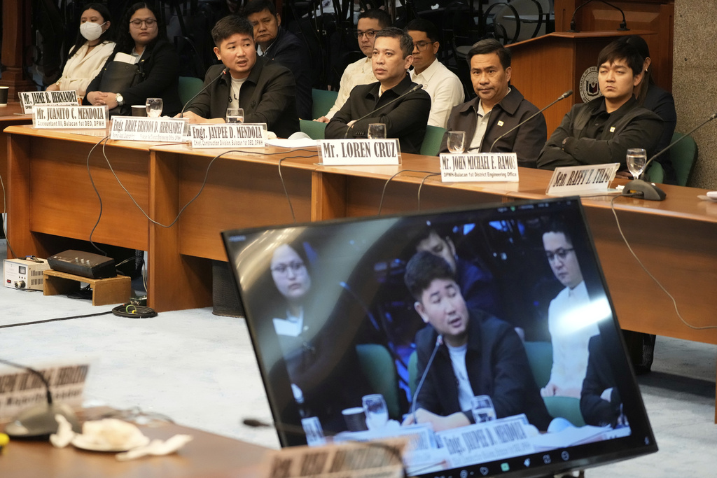 Former DPWH Engineer Brice Ericson Hernandez, third from left, speaks during investigations on flood-control projects at the Senate Blue Ribbon committee in Pasay city, Philippines on Tuesday, Sept. 23, 2025. (AP Photo/Aaron Favila)