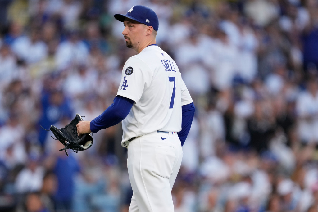Los Angeles Dodgers' pitcher Blake Snell looks towards the Toronto Blue Jays dugout during the first inning in Game 5 of baseball's World Series, Wednesday, Oct. 29, 2025, in Los Angeles. (AP Photo/Ashley Landis)