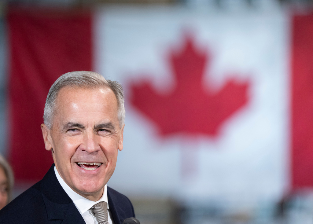 Prime Minister Mark Carney announces a new federal heat pump rebate program while visiting Dettson, a manufacturer of residential and commercial HVAC systems in Sherbrooke, Quebec, Thursday, Oct. 8, 2026. (Christinne Muschi/The Canadian Press via AP)
