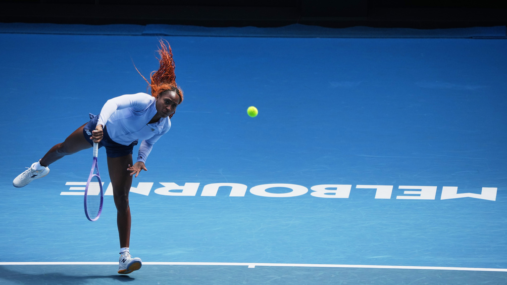 Coco Gauff of the United States serves during a practice session ahead of the Australian Open tennis championship in Melbourne, Australia, Friday, Jan. 16, 2026. (AP Photo/Dita Alangkara)