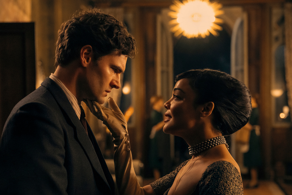 This image released by Amazon Prime shows Tom Bateman, left, and Tessa Thompson in a scene from "Hedda." (Parisa Taghizadeh/Amazon Prime via AP)
