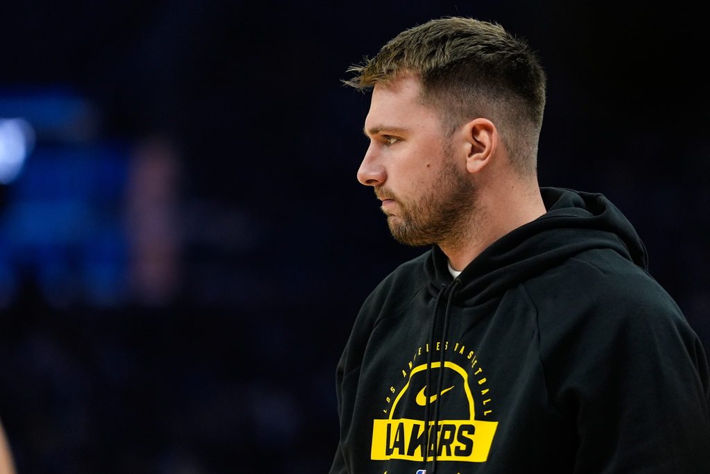 Los Angeles Lakers' Luka Dončić stands on the court during a timeout in the first half of an NBA basketball preseason game against the Golden State Warriors, Sunday, Oct. 5, 2025, in San Francisco. (AP Photo/Godofredo A. Vásquez)