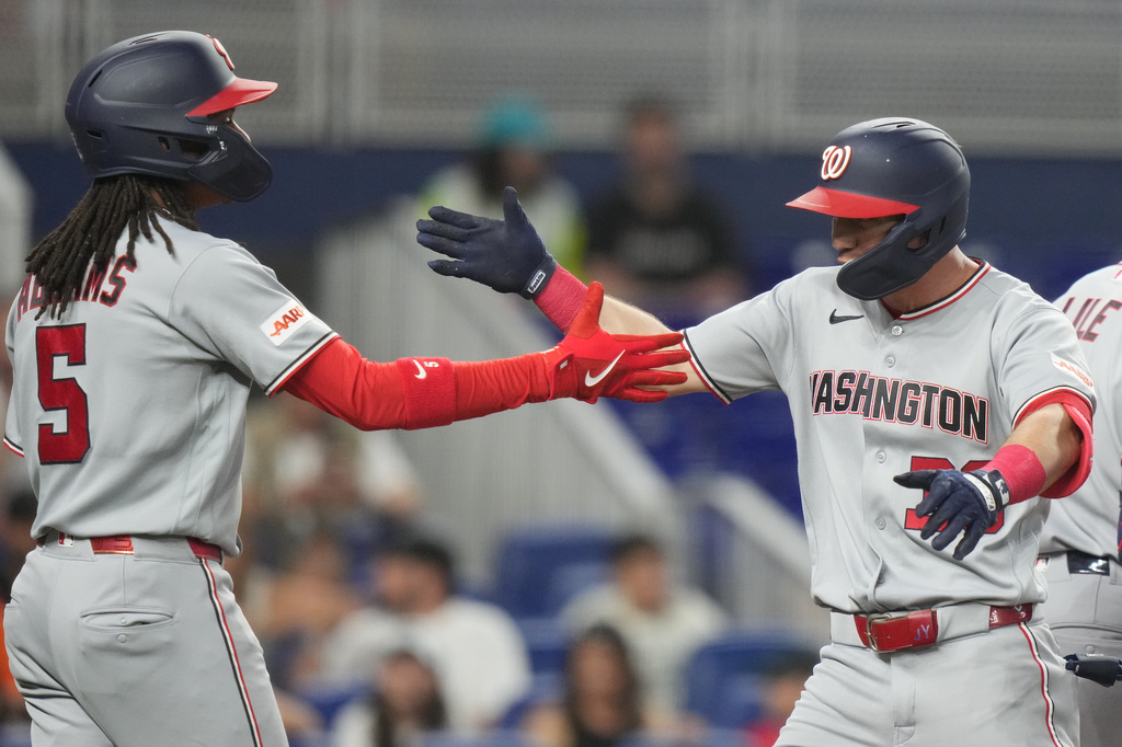 Washington Nationals' Jacob Young (30) is met by CJ Abrams (5) after hitting a two run home run during the first inning of a baseball game against the Miami Marlins, Friday, May 8, 2026, in Miami. (AP Photo/Lynne Sladky)