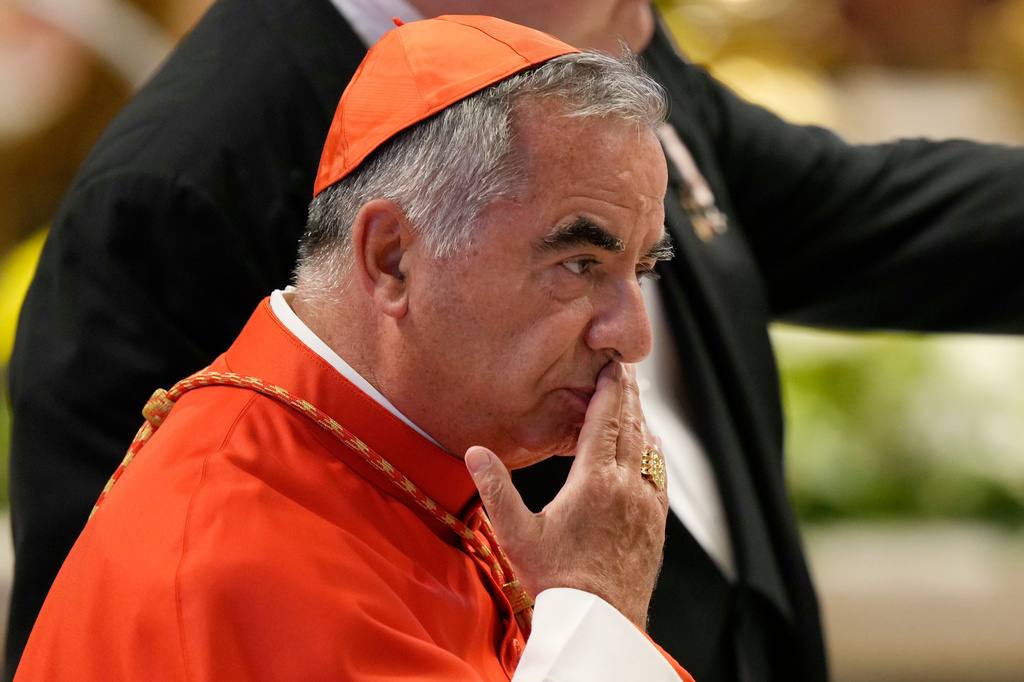 FILE - Cardinal Angelo Becciu attends the consistory inside St. Peter's Basilica at the Vatican, Aug. 27, 2022. (AP Photo/Andrew Medichini, File)