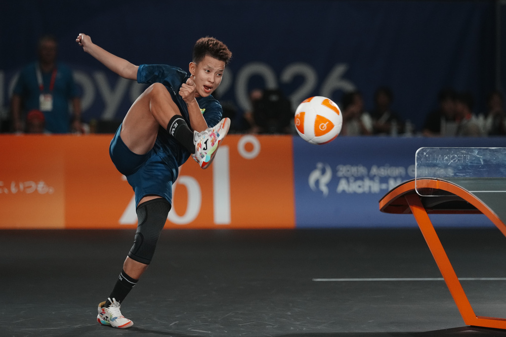 Myanmar's Khin Hnin Wai plays a return against Indonesia's Sumaya during their women's singles teqball final match at the Asian Games in Nagoya, Japan, Sunday, Sept. 20, 2026. (AP Photo/Lee Jin-man)