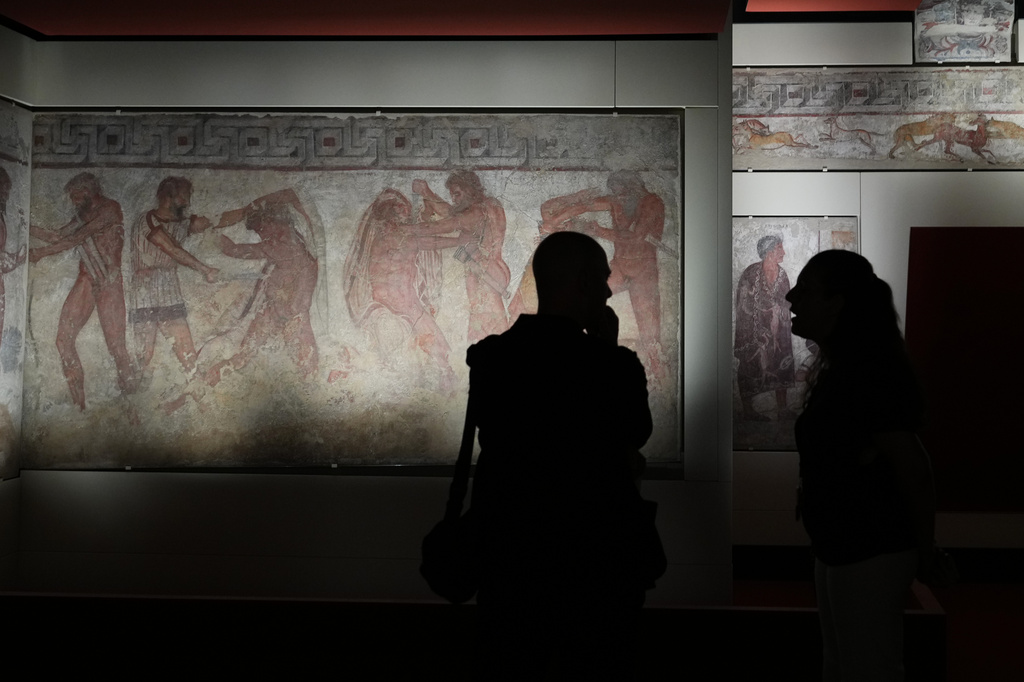 Reporters visit the frescoes, dating from 330–310 B.C., exhibited in the reconstruction of the François Tomb, an Etruscan tomb, at the Villa Giulia Etruscan Museum in Rome, Tuesday, June 30, 2026. (AP Photo/Alessandra Tarantino)