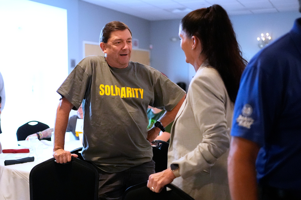 Troy Jackson, Democratic candidate for U.S. Senate, listens to a supporter at the Southern Maine Labor Council breakfast, Monday, Sept. 7, 2026, in South Portland, Maine. (AP Photo/Robert F. Bukaty)