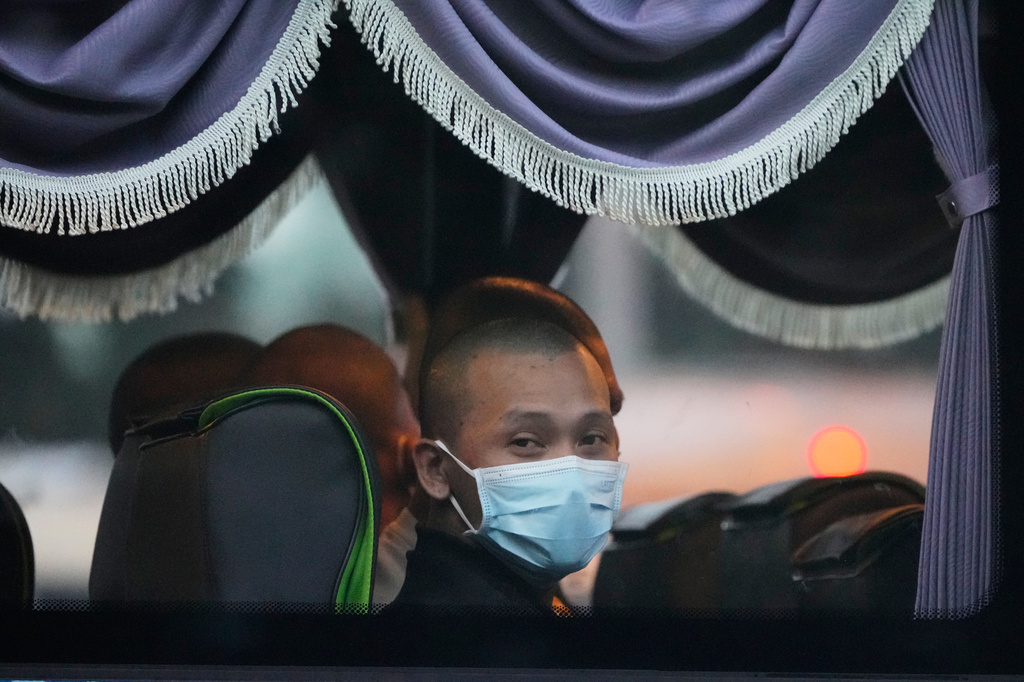 Myanmar nationals look out from a bus in Manjung, Perak state of Malaysia, on Tuesday, Sept. 29, 2026. (AP Photo/Vincent Thian)
