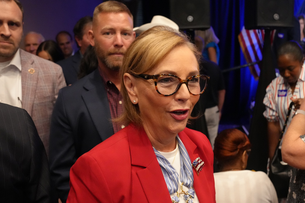 Sen. Darline Graham, R-S.C., heads out into the crowd after winning a special Republican primary runoff to replace her brother, the Sen. Lindsey Graham, R-S.C., in the November general election, Tuesday, Aug. 25, 2026, in Columbia, S.C. (AP Photo/Meg Kinnard)