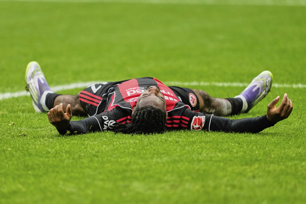 Frankfurt's Elye Wahi is on the ground during a German Bundesliga soccer match between Eintracht Frankfurt and Union Berlin in Frankfurt, Germany, Sunday, Sept. 21, 2025. (AP Photo/Michael Probst)