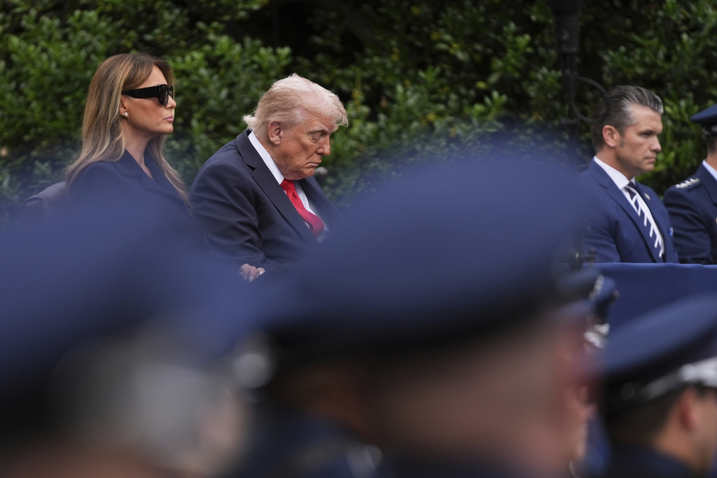 President Donald Trump, first lady Melania Trump and Defense Secretary Pete Hegseth, listen as names are read during a ceremony to commemorate the 24th anniversary of the 9/11 attacks, Thursday, Sept. 11, 2025, at the Pentagon in Washington. (AP Photo/Evan Vucci)
