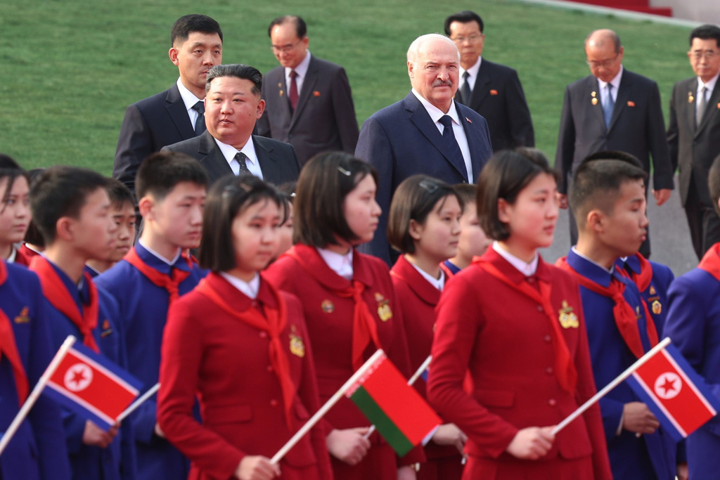 In this photo released by Belarus' Presidential Press Service, North Korea's leader Kim Jong Un, center left, and Belarusian President Alexander Lukashenko, center right, attend an official meeting ceremony in Pyongyang, North Korea, Wednesday, March 25, 2026. (Belarus' Presidential Press Service via AP)