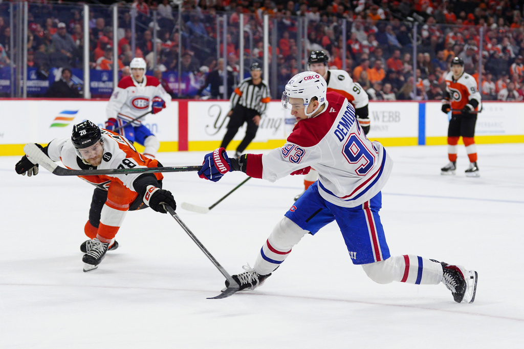 Montréal Canadiens' Ivan Demidov, right, takes a shot past the reach of Philadelphia Flyers' Jacob Gaucher during the first period of an NHL hockey game, Tuesday, April 14, 2026, in Philadelphia. (AP Photo/Derik Hamilton)