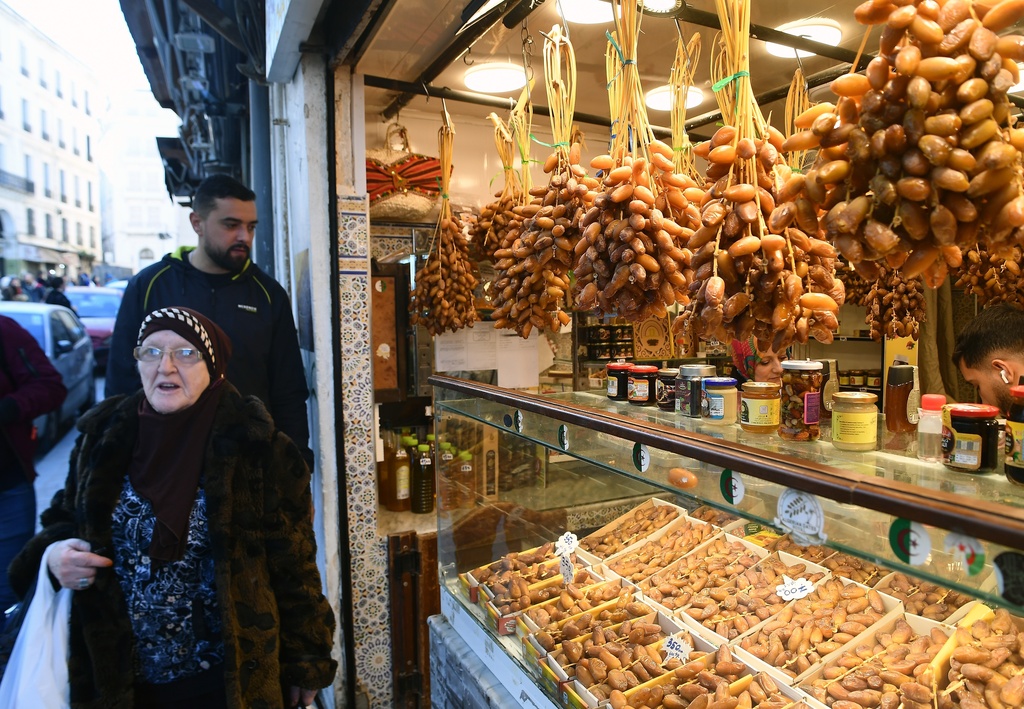 People stock up on food at a market in Algiers, Algeria, Thursday, Feb. 17, 2026, before the start of the holy month of Ramadan. (AP Photo/Fateh Guidoum)
