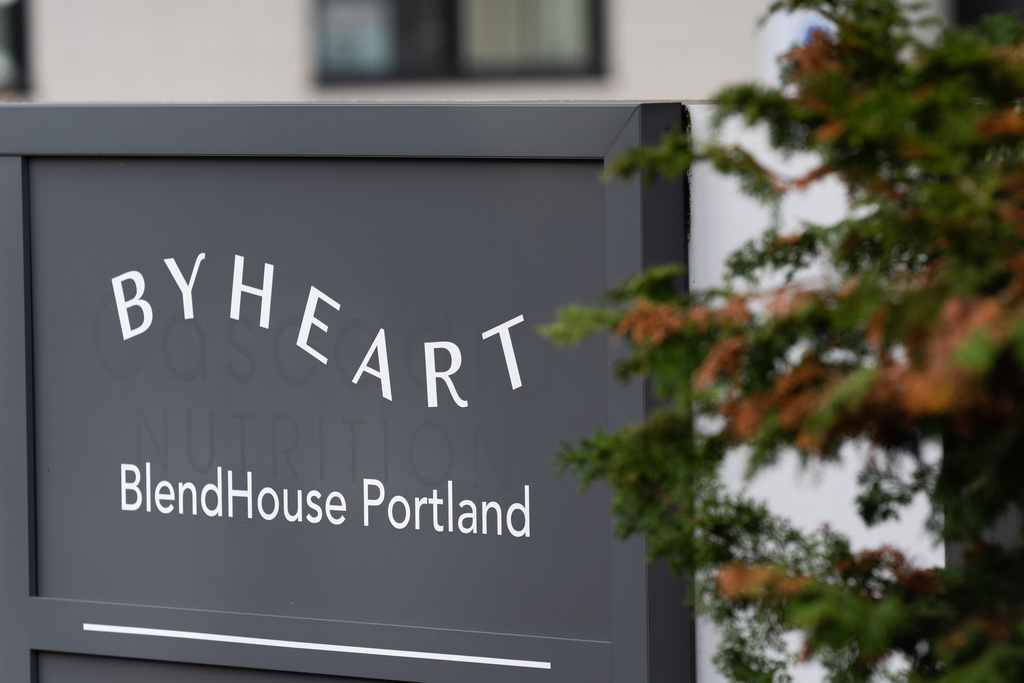 A sign for ByHeart, a manufacturer of organic baby formula, is displayed outside a building that houses a plant for the company on Tuesday, Nov. 11, 2025, in Portland, Ore. (AP Photo/Jenny Kane)