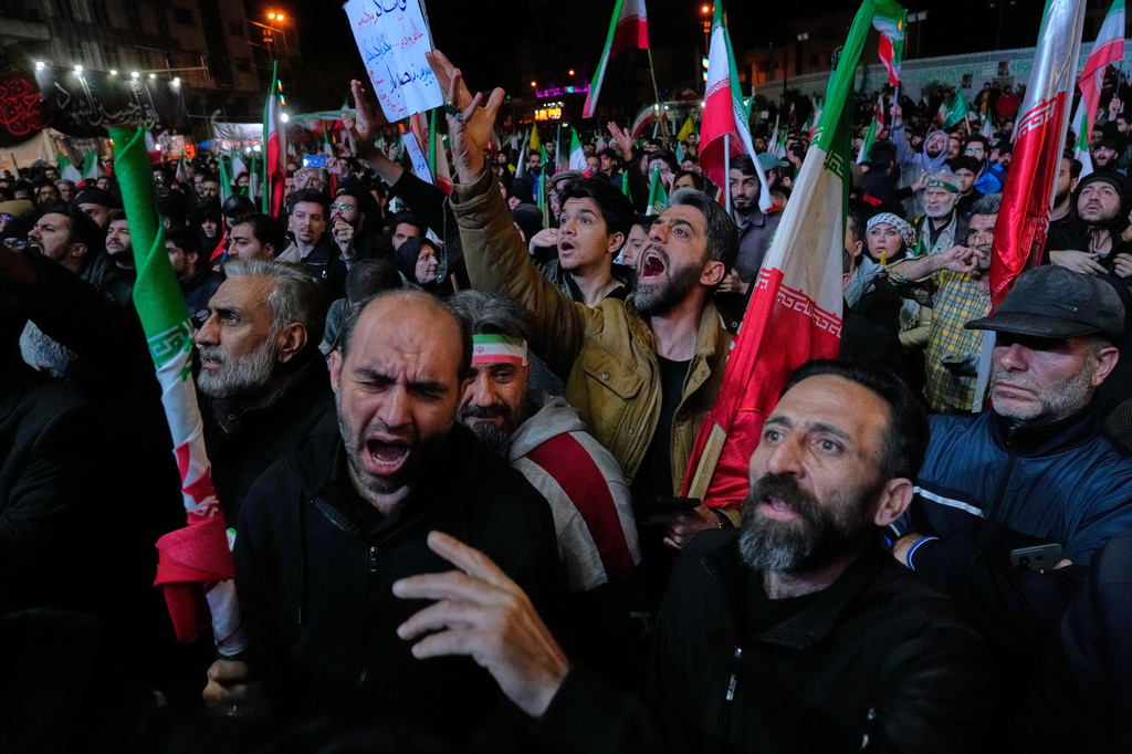 Iranian pro-government demonstrators attend a gathering after announcement of a two-week ceasefire in the war with the United States and Israel, at the Enqelab-e-Eslami, or Islamic Revolution, Square, in Tehran, Iran, Wednesday, April 8, 2026. (AP Photo/Vahid Salemi)