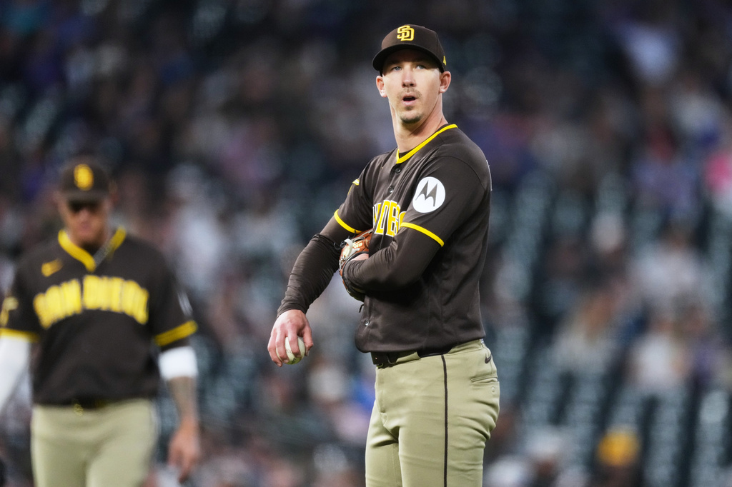 San Diego Padres starting pitcher Walker Buehler waits to be pulled form the mound after issuing a walk too Colorado Rockies' Willi Castro in the third inning of a baseball game Wednesday, April 22, 2026, in Denver. (AP Photo/David Zalubowski)