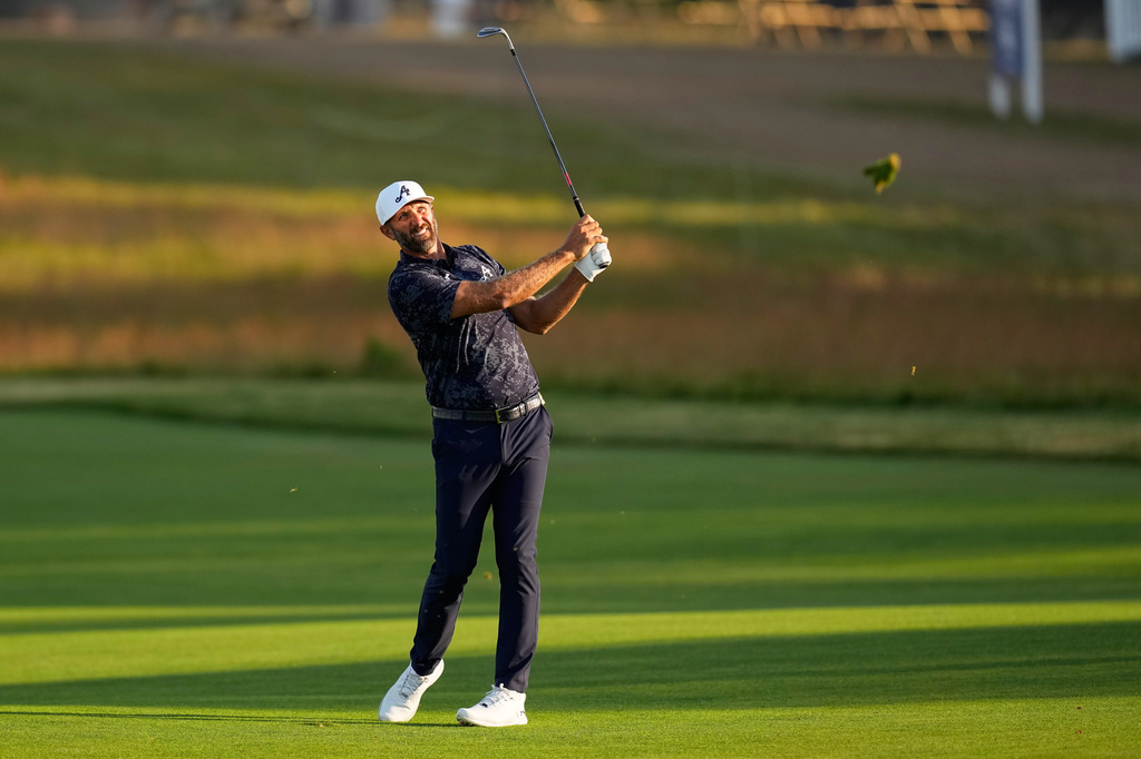 Dustin Johnson hits from the fairway on the third hole during the first round of the U.S. Open golf tournament at Shinnecock Hills Golf Club in Southampton, N.Y., Thursday, June 18, 2026.(AP Photo/David J. Phillip)