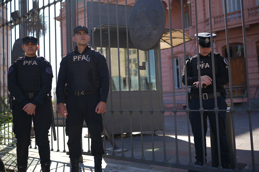 Police stand outside government house in Buenos Aires, Argentina, Thursday, April 23, 2026. (AP Photo/Rodrigo Abd)