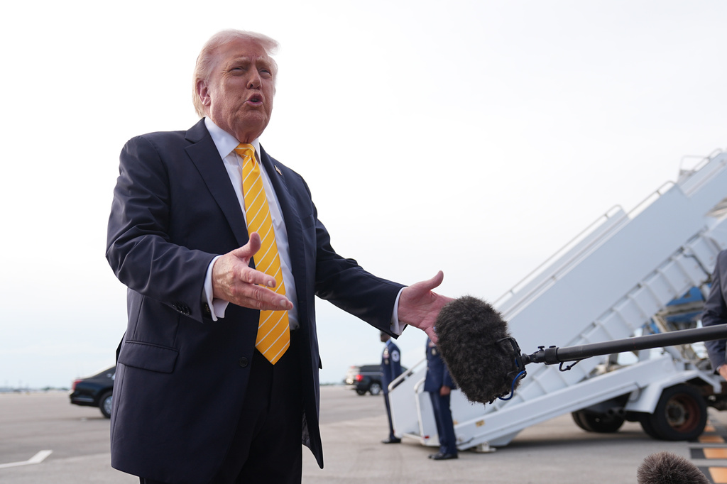 President Donald Trump talks to reporters before he boards Air Force One at Palm Beach International Airport in West Palm Beach, Fla., Saturday May 2, 2026, en route Miami. (AP Photo/Matt Rourke)