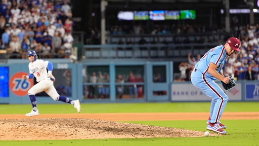 Philadelphia Phillies pitcher Orion Kerkering looks down at a ground ball from Los Angeles Dodgers' Andy Pages before committing a throwing error to home platev and allowing the game-winning run to score during the eleventh inning in Game 4 of baseball's National League Division Series against the Los Angeles Dodgers, Thursday, Oct. 9, 2025, in Los Angeles. (AP Photo/Mark J. Terrill) Philadelphia Phillies pitcher Orion Kerkering looks down at a ground ball from Los Angeles Dodgers' Andy Pages before committing a throwing error to home platev and allowing the game-winning run to score during the eleventh inning in Game 4 of baseball's National League Division Series against the Los Angeles Dodgers, Thursday, Oct. 9, 2025, in Los Angeles. (AP Photo/Mark J. Terrill)