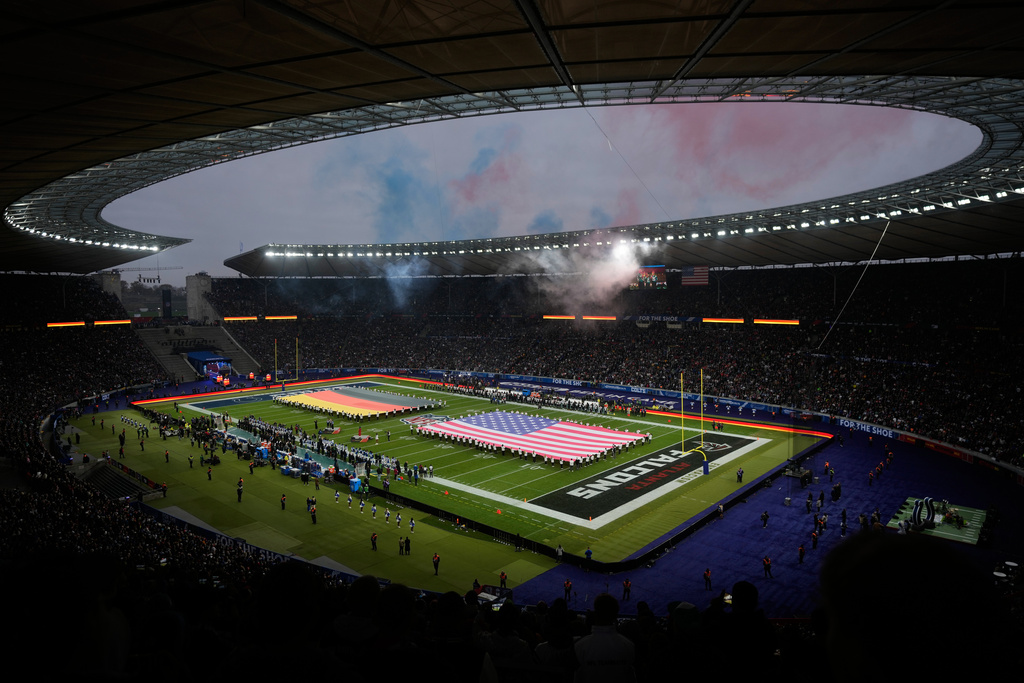 FILE - Fans cheer during the opening ceremony prior to the NFL game between the Indianapolis Colts and the Atlanta Falcons in Berlin, Germany, Nov. 9, 2025. (AP Photo/Markus Schreiber, File)