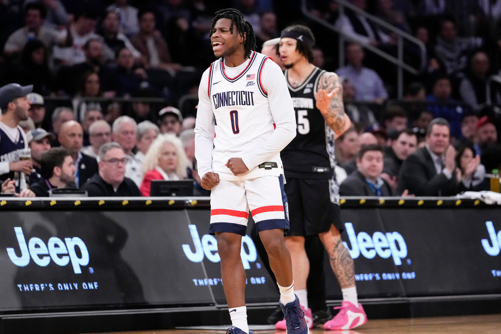UConn guard Malachi Smith (0) reacts after stealing the ball during the first half of an NCAA college basketball game against Georgetown in the semifinals of the Big East tournament, Friday, March 13, 2026, in New York. (AP Photo/Yuki Iwamura)