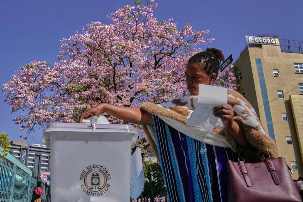 A woman casts her vote during the presidential election at a polling station in the capital, Kampala, Uganda, Thursday, Jan. 15, 2026. (AP Photo/Brian Inganga)