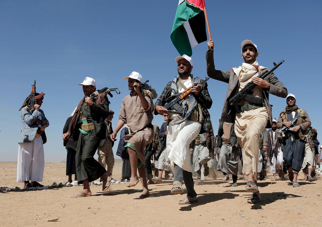 FILE - Houthi fighters march during a rally of support for the Palestinians in the Gaza Strip and against the U.S. strikes on Yemen outside Sanaa on Jan. 22, 2024. (AP Photo, File)