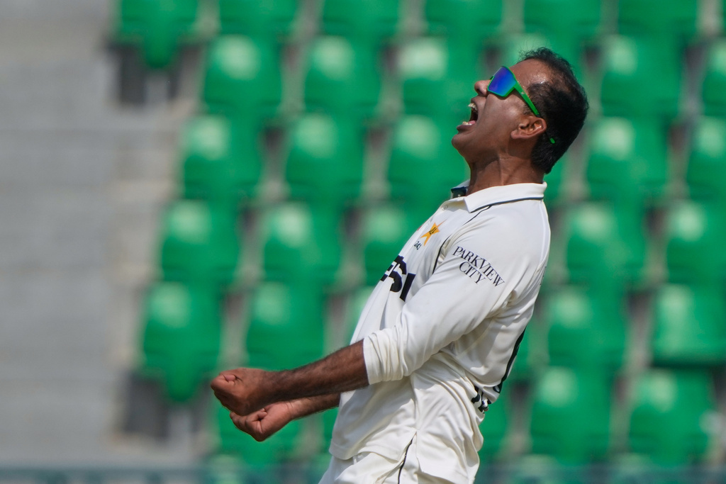 Pakistan's Noman Ali celebrates after the taking the wicket of South Africa's Dewald Brevis during the fourth day of the first test cricket match between Pakistan and South Africa, in Lahore, Pakistan, Wednesday, Oct. 15, 2025. (AP Photo/K.M. Chaudary)