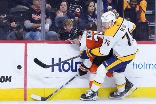 Philadelphia Flyers' Matvei Michkov, left, and Nashville Predators' Brady Skjei battle for the puck during the second period of an NHL hockey game Thursday, Oct. 30, 2025, in Philadelphia. (AP Photo/Matt Slocum) Philadelphia Flyers' Matvei Michkov, left, and Nashville Predators' Brady Skjei battle for the puck during the second period of an NHL hockey game Thursday, Oct. 30, 2025, in Philadelphia. (AP Photo/Matt Slocum)