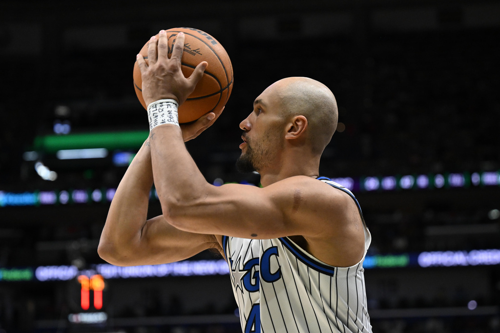 Orlando Magic guard Jalen Suggs (4) shoots in the second half against the New Orleans Pelicans in an NBA basketball game in New Orleans, Sunday, April 5, 2026. (AP Photo/Ella Hall)